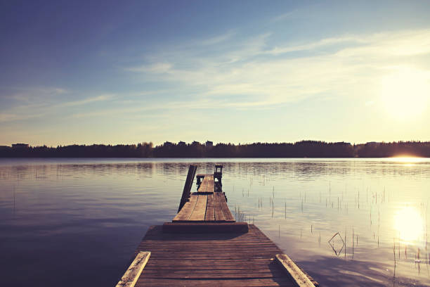istock Old boat jetty with fantastic sunlight 1136556129