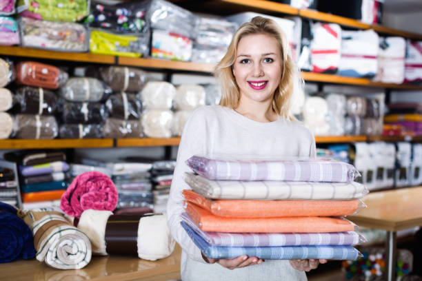 istock Young female customer boasting purchased home textiles 1136556861