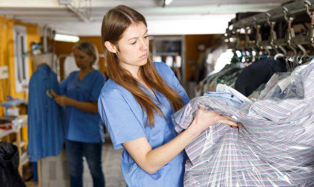 istock Two women working at dry-cleaning salon 1136557150