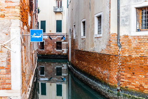 Gondola sign on a empty canal in Venice, Italy