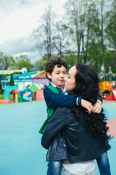 istock Son and mother in the amusement park. 1136559402