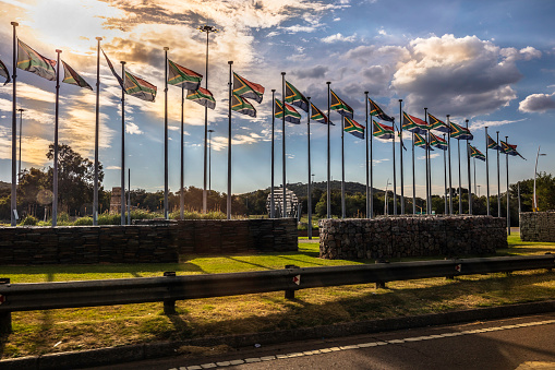 South African Flags blowing in the wind displayed at a traffic circle in Pretoria.
Pretoria in South Africa is also known as 