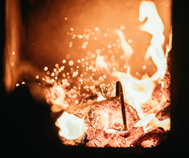 istock Poking stick in a tiled oven, flame and sparks 1136559595