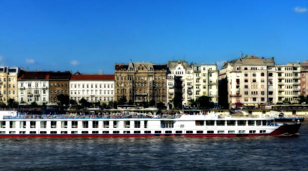 istock Danube river panorama in Budapest with white cruise boat 1136559724