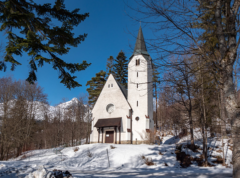 Front view of catholic church in ski resort Tatrzanska Lomnica, Slovakia