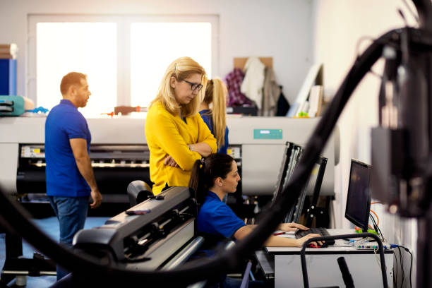 istock Coworkers in printing factory 1136561420