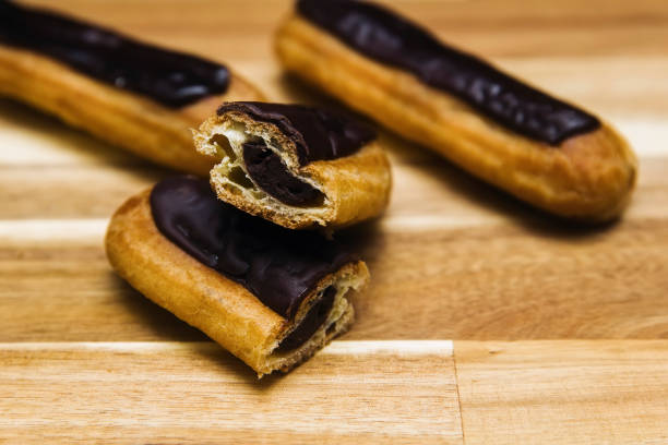 istock Eclair crispy creamy cake with dark chocolate 1136561819