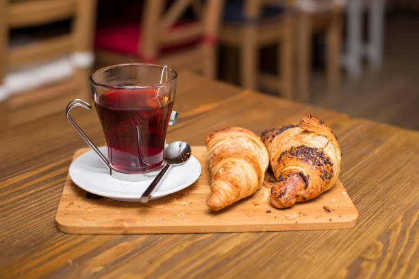 istock Cup of tea and croissants 1136561830