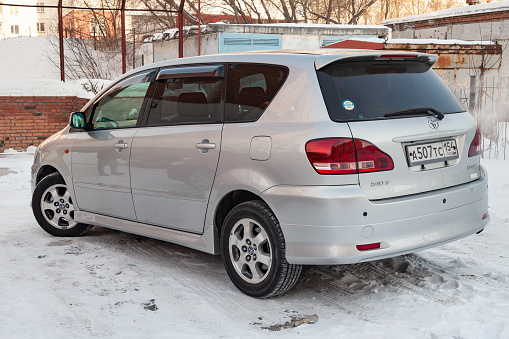 Novosibirsk, Russia - 03.10.2019: Rear view of Toyota Ipsum last generation in silver color after cleaning before sale in a winter day and snow background