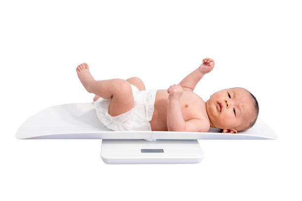 istock Baby in weight scale 1136561884