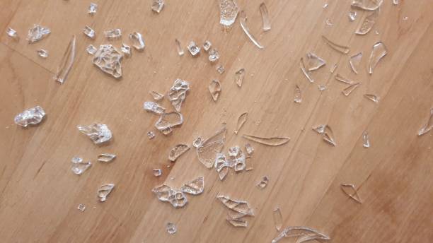 istock Broken glass on wooden floor 1136563617