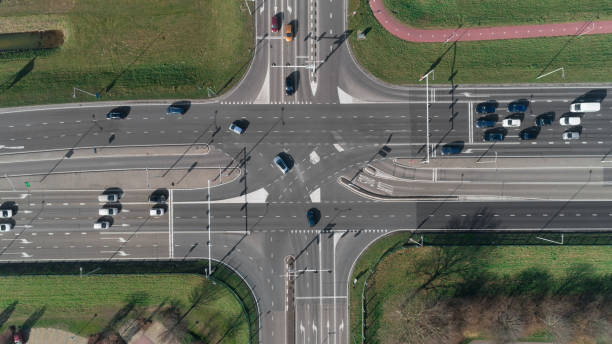 istock Highway intersection with cars and traffic lights. Top view from drone 1136564011