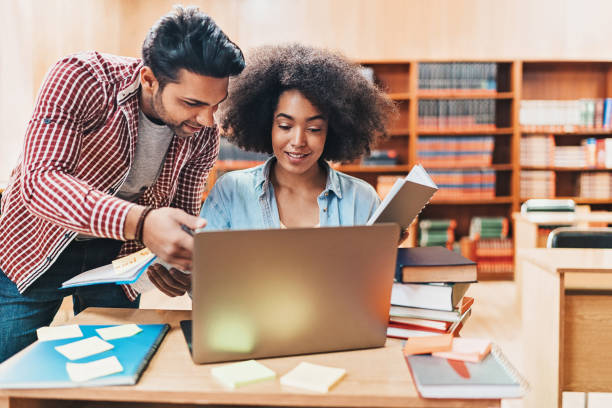 istock Couple of students working together 1136564643