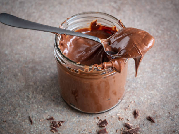 istock Chocolate Cream in a Disposable Glass And on a Spoon 1136564816