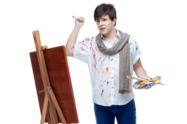 istock Cheerful painter with brush and palette. 1136567132