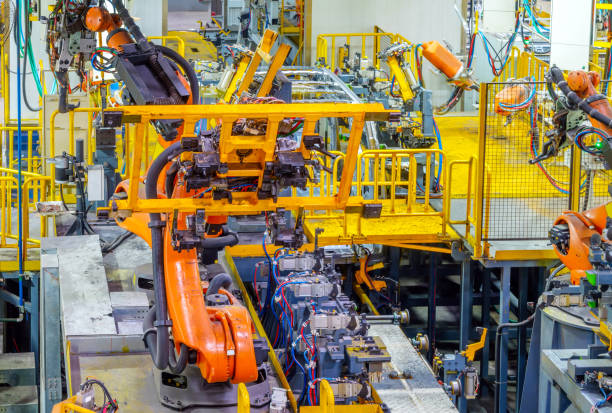 linea di produzione auto del robot - car industry robot arm car plant foto e immagini stock
