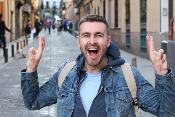istock Man with fingers crossed outdoors 1136574024