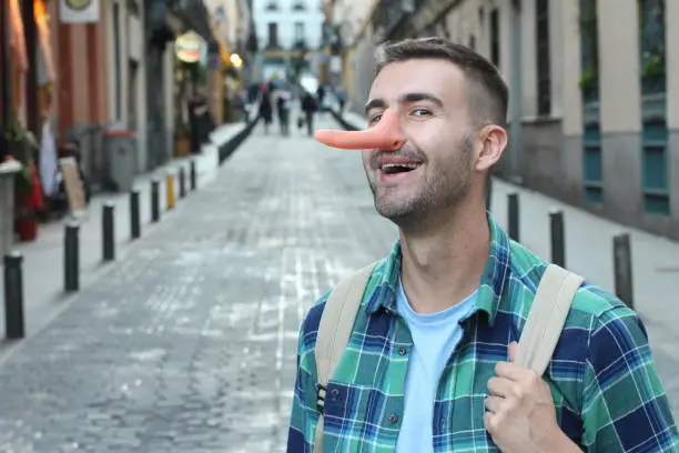 Man with a very long nose.