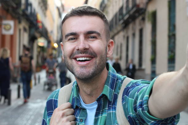 istock Handsome man taking a selfie outdoors 1136574573