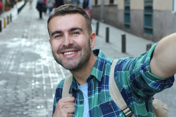 istock Handsome man taking a selfie outdoors 1136574738
