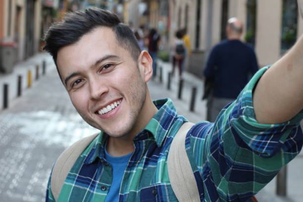 istock Handsome ethnic male taking a self portrait 1136574759