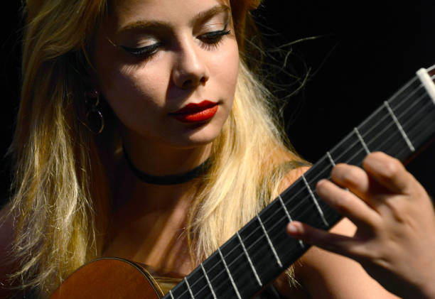 istock Young Woman and Guitar Concert 1136578498