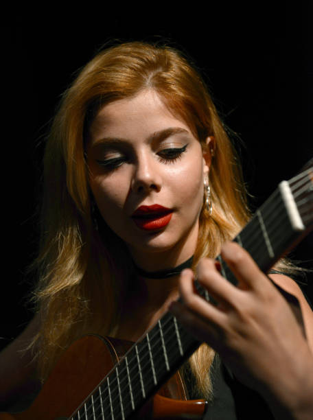 istock Woman playing guitar 1136578560
