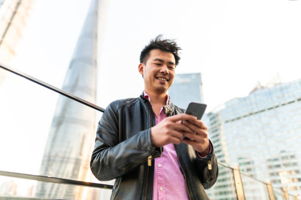 istock Handsome guy text messaging on the street 1136580595