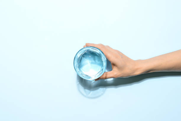 Water drinking minimalist concept stock photo
