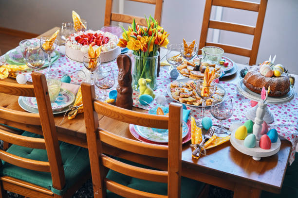 istock Decorated Table for Easter with Easter Eggs, Cookies, Cake and Flowers 1136583215