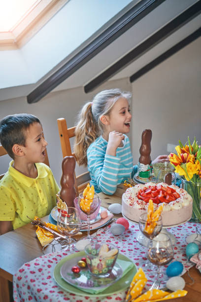 istock Cute Little Kids Having Fun on a Decorated Easter Table 1136583239