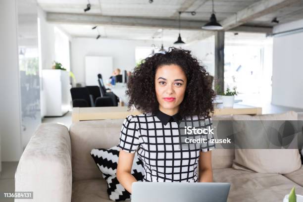 Creative Professional Sitting At Office With Laptop Stock Photo - Download Image Now
