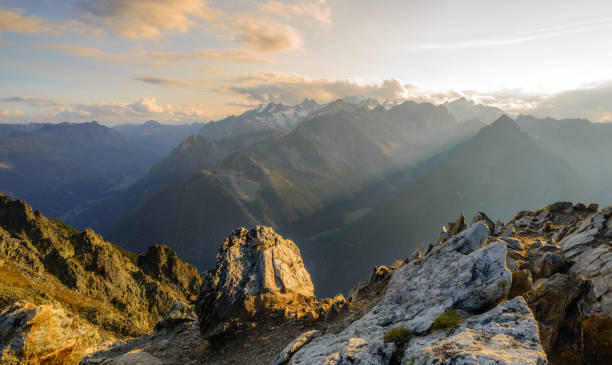 Summit sunset in the Swiss alps Sunset from the top of a mountain in the Valais region of Switzerland, looking towards Mont Blanc, Chamonix and the main ridge of the French alps. swiss culture photos stock pictures, royalty-free photos & images