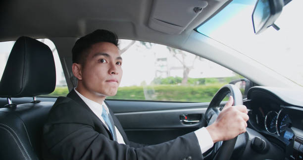 istock business man driving car 1136586634