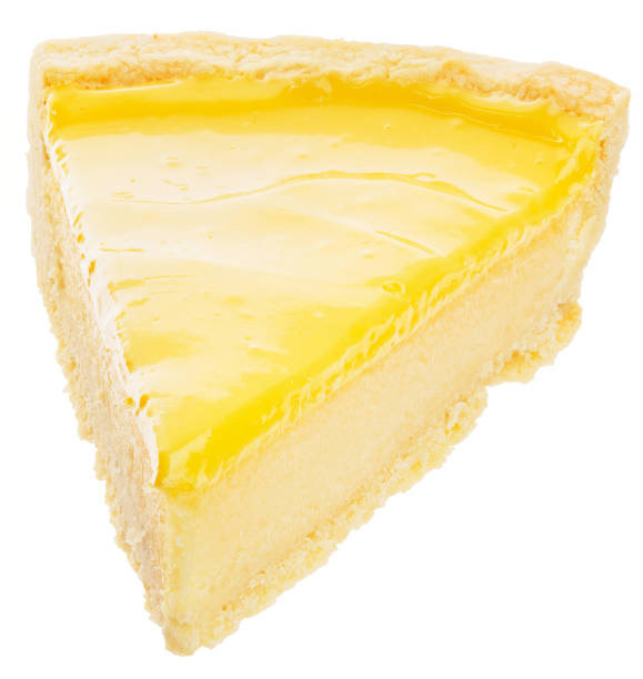 Piece of fresh lemon cheesecake isolated on white background