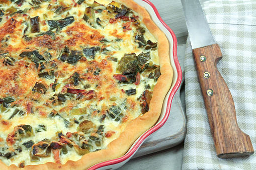 whole quiche with leeks and pork bacon