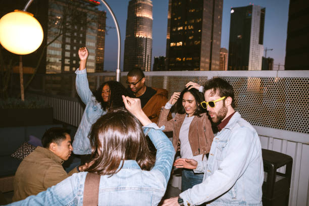 istock Friends Have Fun On Downtown Los Angeles Rooftop 1136592012