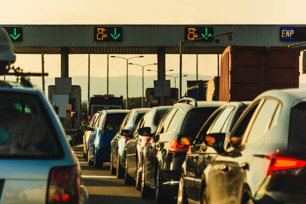 Cars and trucks waiting at point of toll highway - Toll station check point traffic jam - Highway toll peage Cars waiting at highway pay toll peage serbia stock pictures, royalty-free photos & images