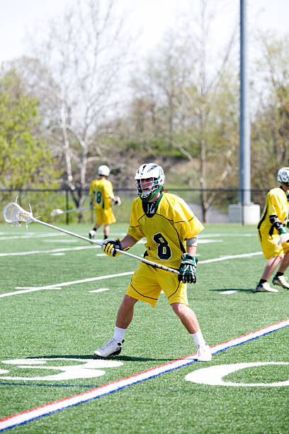 istock High School lacrosse player on defense 113659408