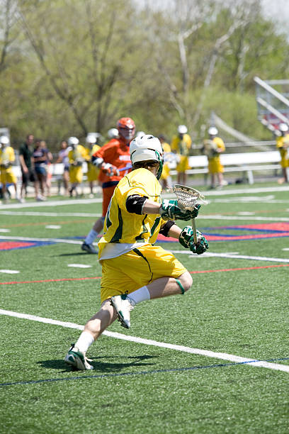 istock High school lacrosse player on the attack 113659411