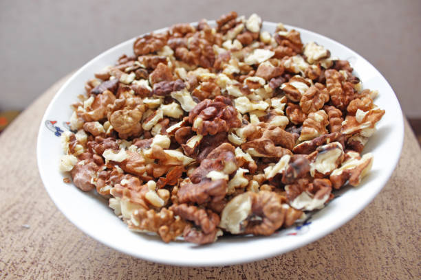 istock brown kernels walnuts in a white bowl on a brown 1136594545