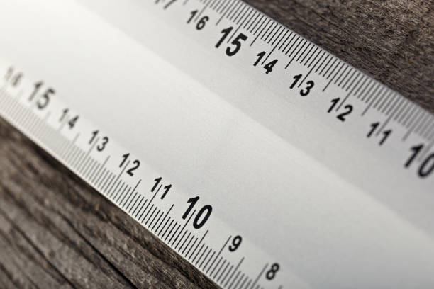 istock Measuring instrument on a wooden background. Tool for repair and construction. 1136594574