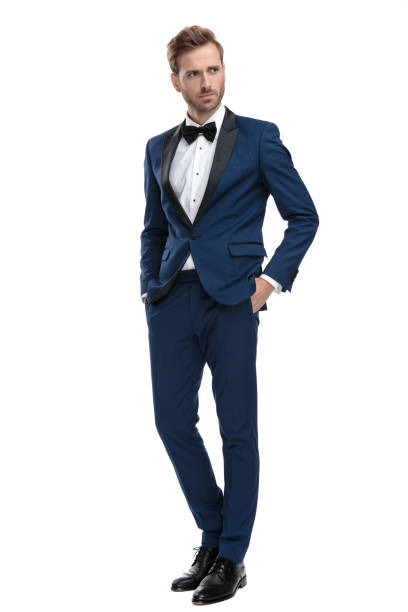 istock serious guy stands with hands in pockets and looks away 1136594681