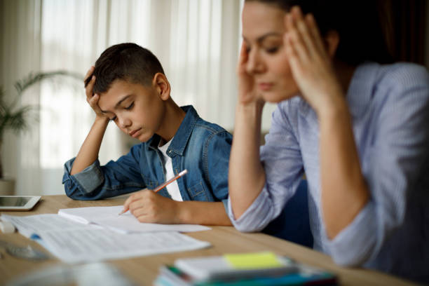 istock Teenage boy having problems in finishing homework 1136594912
