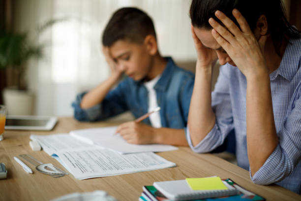 istock Teenage boy having problems in finishing homework 1136595259
