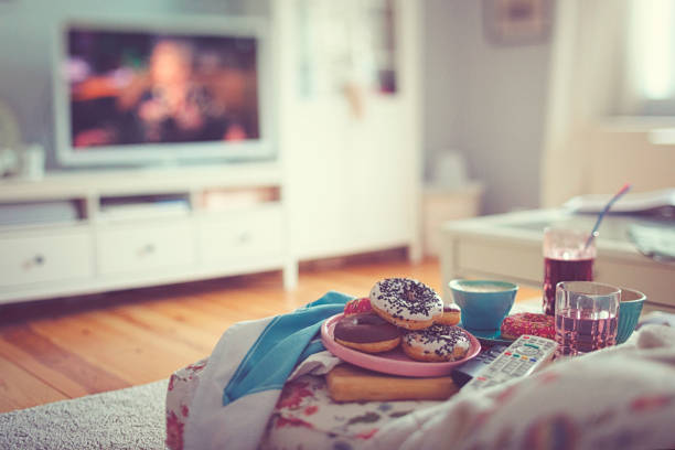 Colourful donuts, coffee and lemonade for a cozy TV afternoon