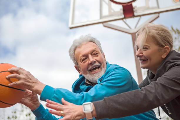istock Seniors having fun playing basketball 1136596920