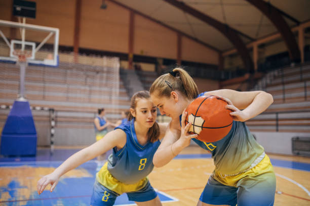 istock Girls playing basketball 1136600747
