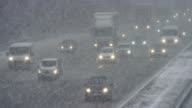 istock LD Cars driving on a highway in a heavy snow storm 1136602671