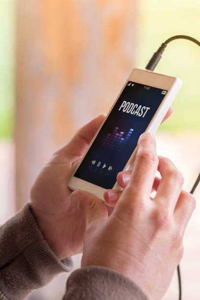 istock hands holding podcast smartphone 1136603530